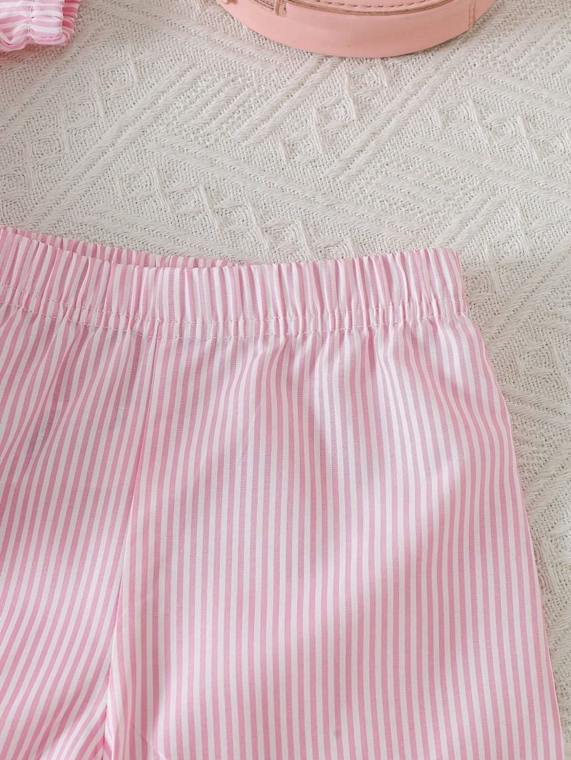 Set rosa con moños y shorts con volantes