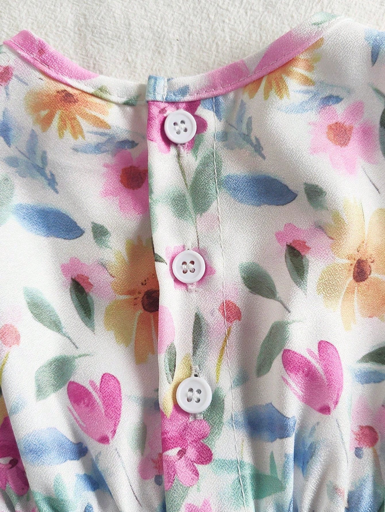 Vestido floral rosa sin mangas con moño para bebé