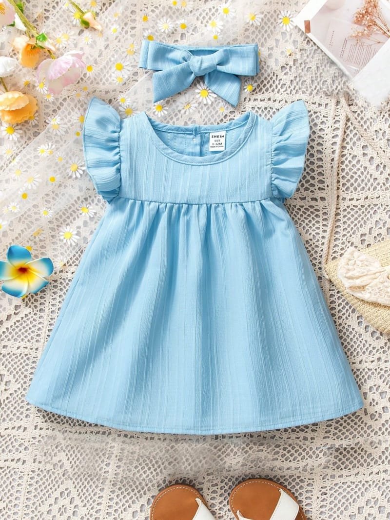 Vestido azul liso con diadema de moña
