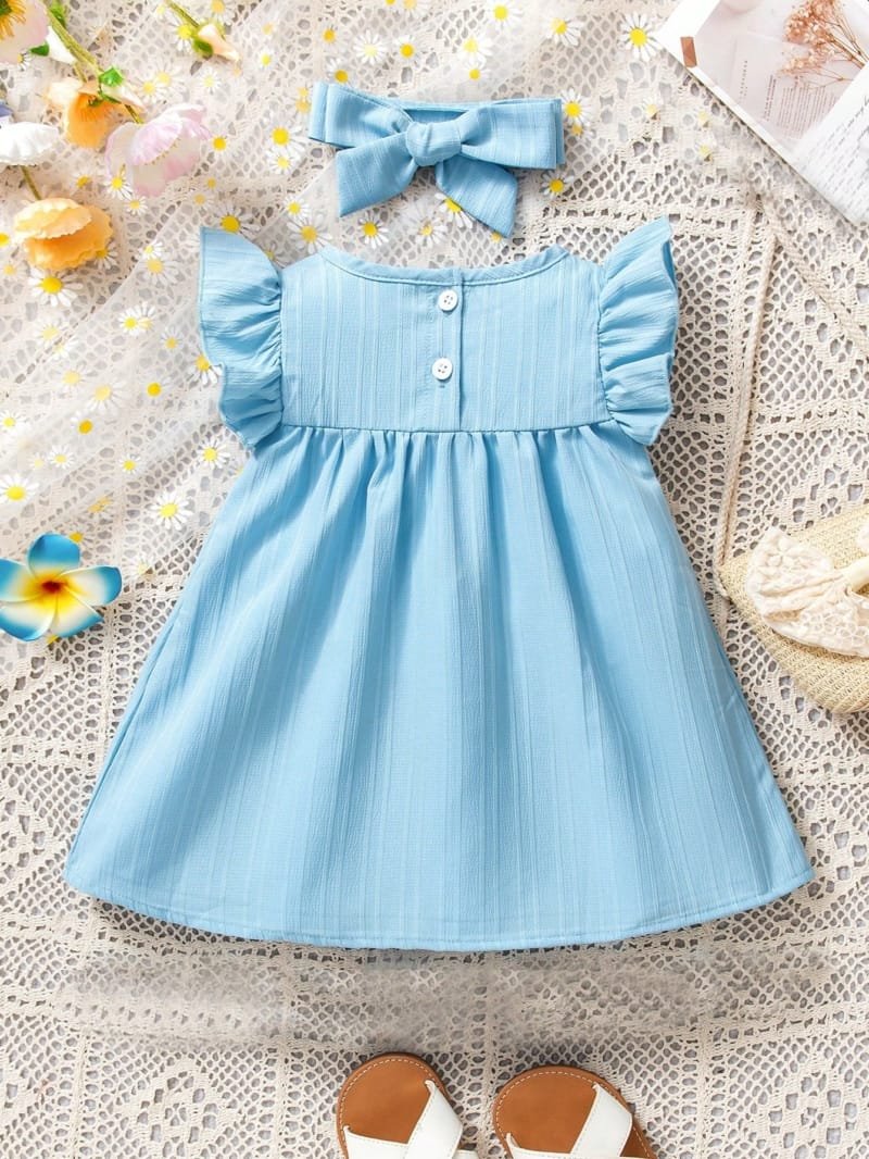 Vestido azul liso con diadema de moña