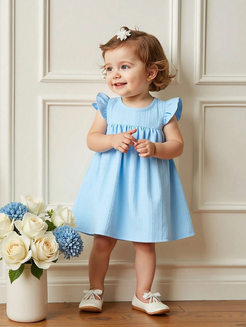 Vestido azul liso con diadema de moña