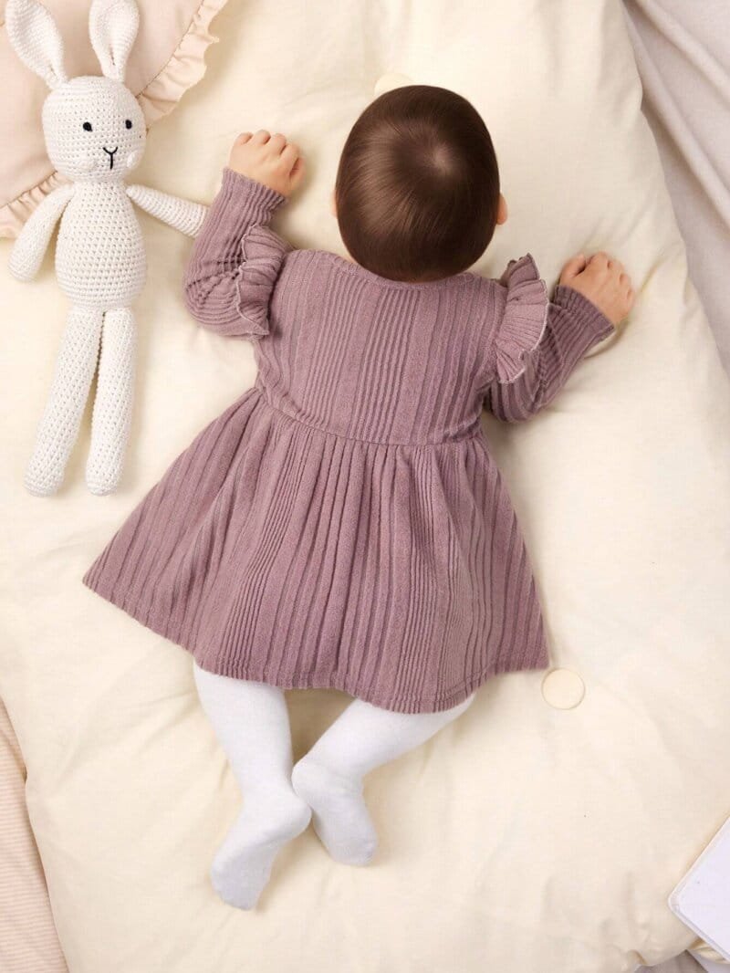Vestido rosa de punto con mangas largas