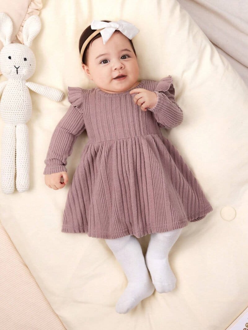 Vestido rosa de punto con mangas largas