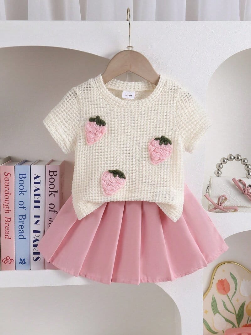 Conjunto multicolor con blusa tejida y falda rosa