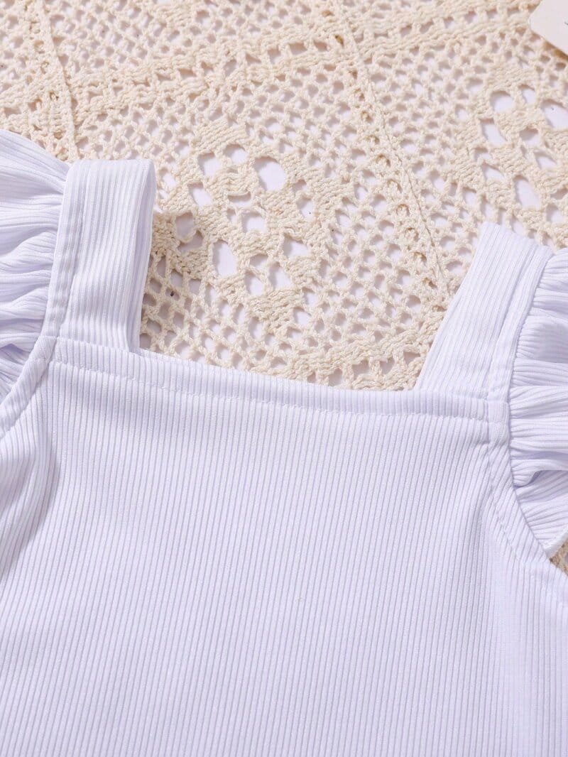Conjunto blanco con falda verde floral para bebé