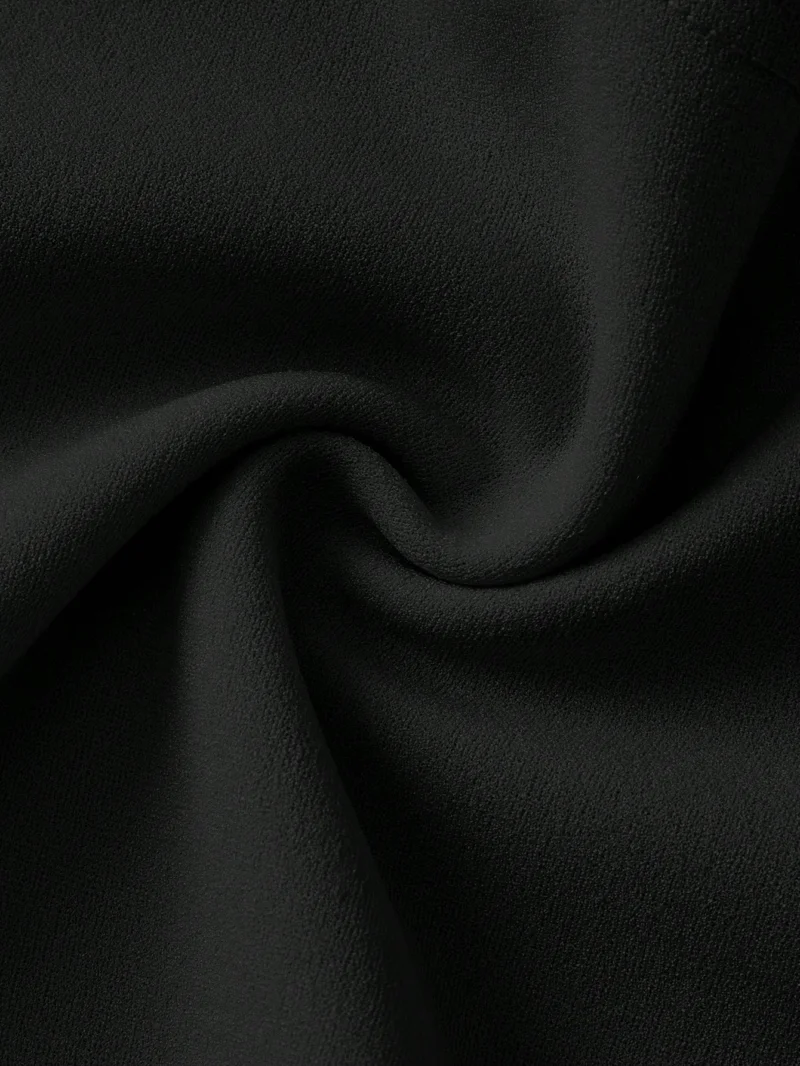 Vestido negro elegante con lazo blanco para bebé