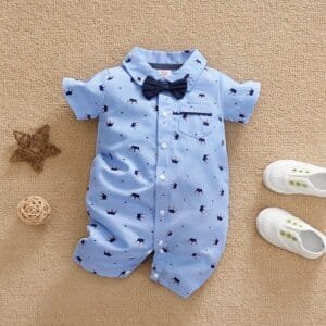 Pelele azul con moño y estampado de corona