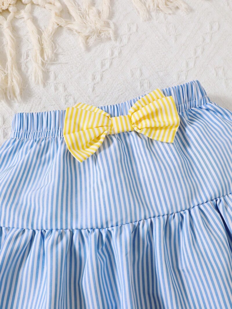 Set azul y amarillo con moño para niña bebé