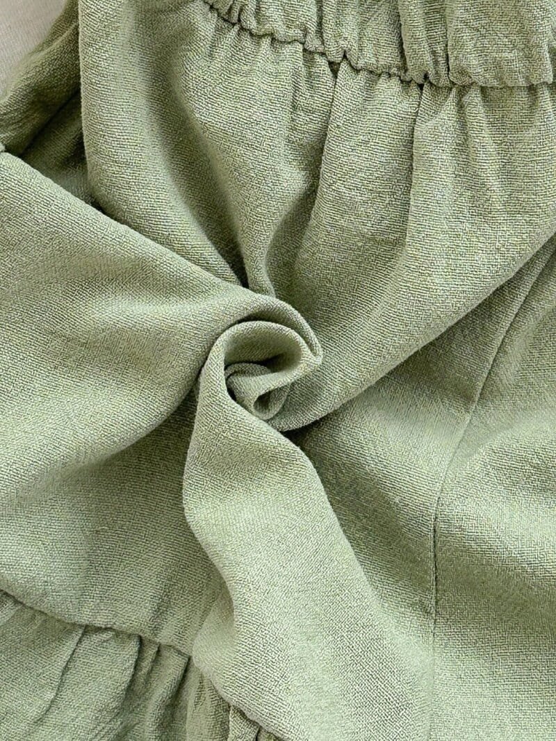Enterizo verde menta con tirantes y cinturón para bebé niña