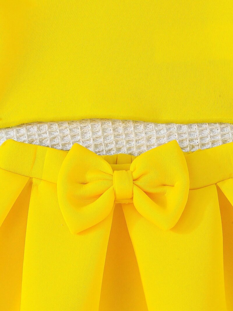 Set amarillo bebé niña con top de tirantes y falda con moño