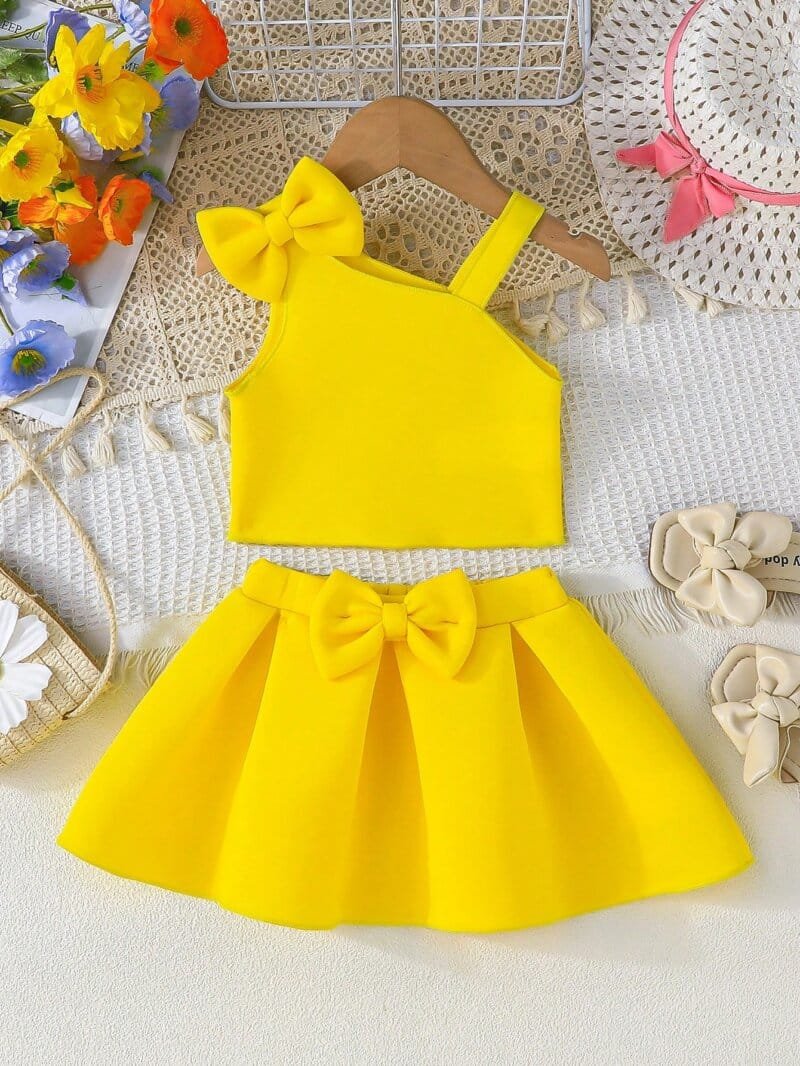 Set amarillo bebé niña con top de tirantes y falda con moño