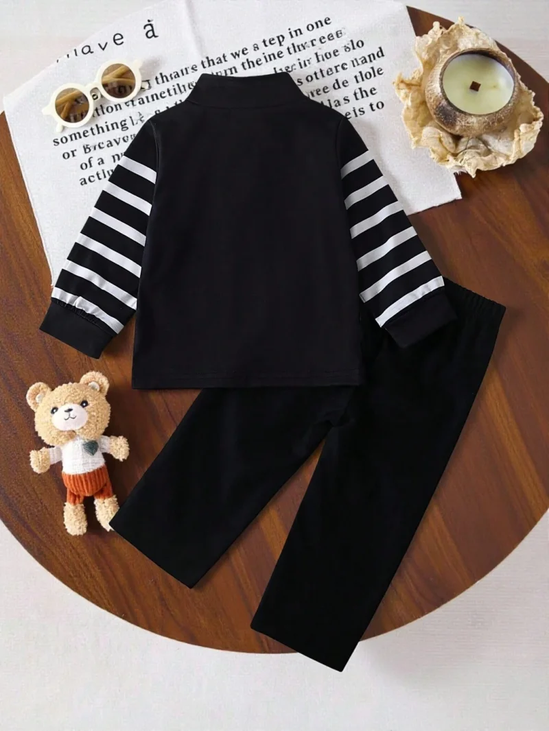 Conjunto negro para bebé niño con rayas y pantalón casual