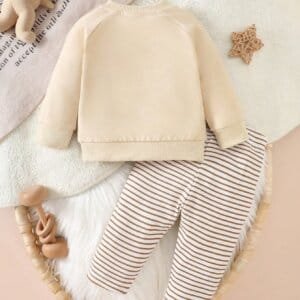 Conjunto albaricoque con sudadera dinosaurio y pantalón a rayas