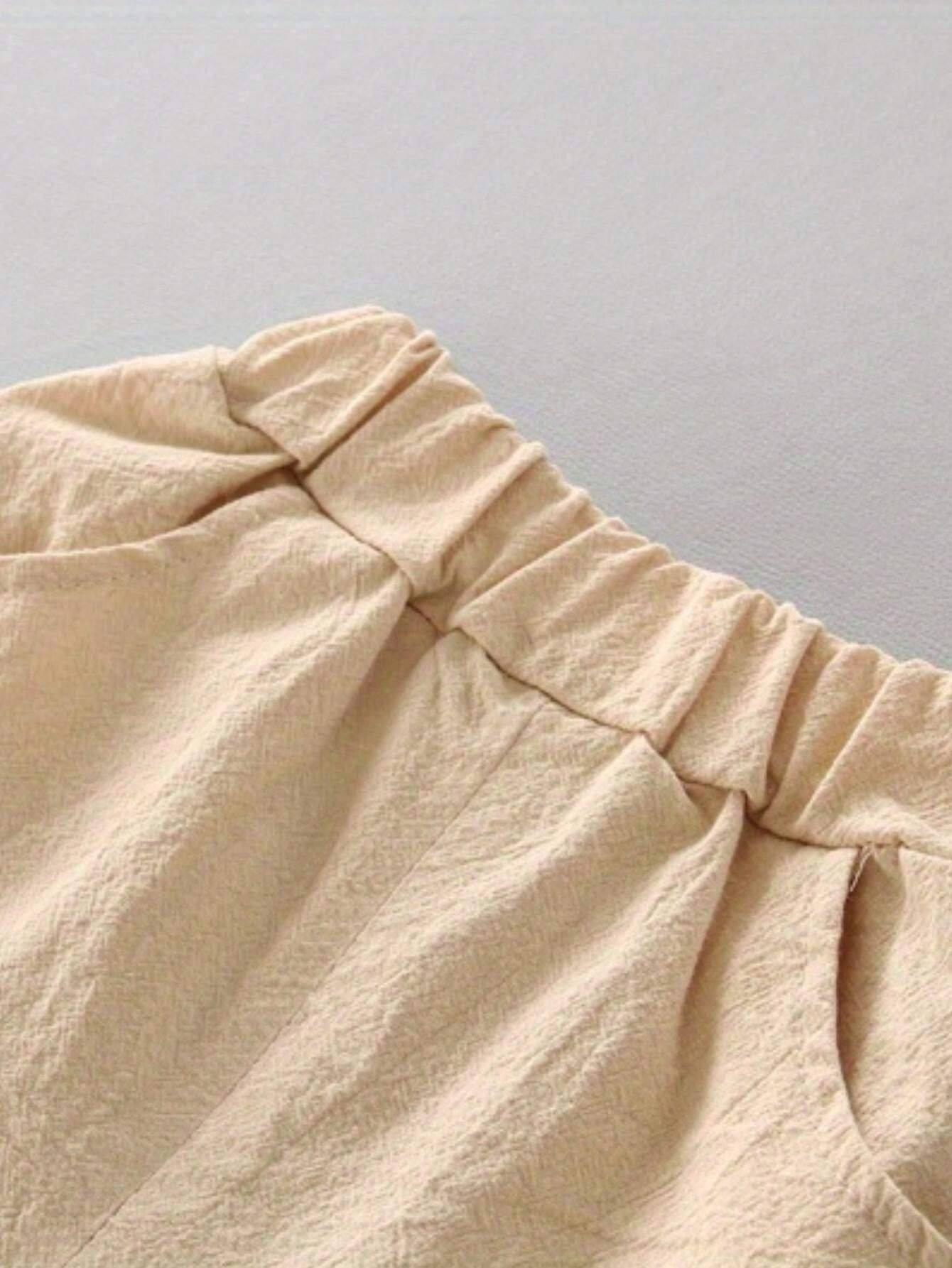 Conjunto azul beige con estampado de dinosaurios