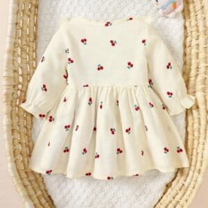 Vestido albaricoque dulce con volantes y lazos rojos