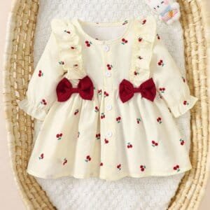 Vestido albaricoque dulce con volantes y lazos rojos